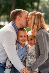 Happy family having fun together in the park outdoor