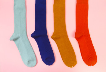 colorful socks on pink  background  - Image