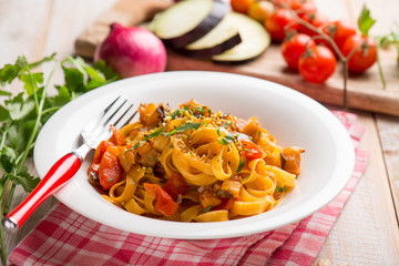 tagliatelle pasta with eggpalnts and fresh tomatoes