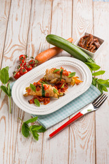 turkey rolled up with dried tomatoes zucchinis and mint leaf