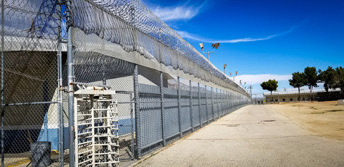 Prison fences and turnstile of Mira Loma Detention Center in Lancaster California.