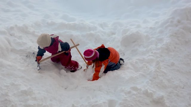 children playing in the snow
