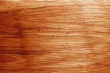 Wooden board texture in orange tone.