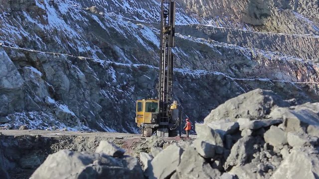 A drilling rig is being prepared for work in a mining quarry.
