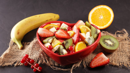 fresh fruit salad in red heart bowl