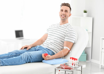 Man donating blood in hospital