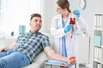 Man donating blood in hospital