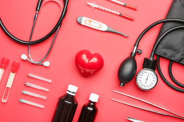 First aid kit on color background
