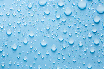 Drops of water on color background