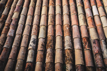 Close up of traditional orange clay Portugal roof tiles  on a castle in Silves