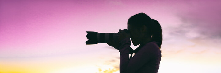 Professional photographer woman silhouette taking night photo during photography safari travel tour...