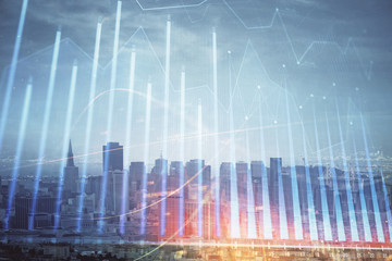 Forex graph on city view with skyscrapers background multi exposure. Financial analysis concept.