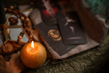 Magic scene, Mystical atmosphere, candles on the table, esoteric concept, fortune telling and predictions at home 