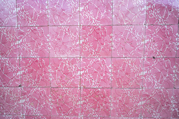 Bright pink tiles on a building wall in Silves, Portugal, traditional architecture facade of the region