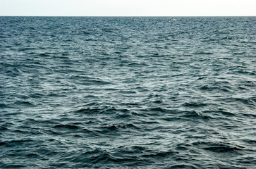 Obraz premium Texture of the surface of the blue ocean.