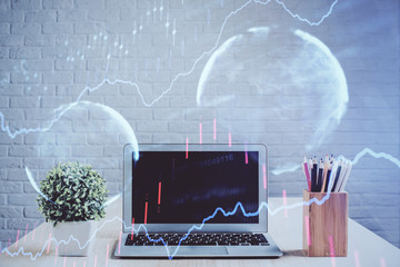 Financial graph colorful drawing and table with computer on background. Double exposure. Concept of...