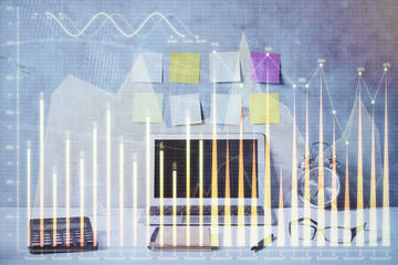 Double exposure of forex graph and work space with computer. Concept of international online trading.