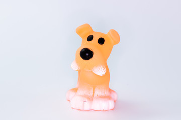 Orange dog toy figurine on white background