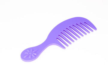 Children toy hairbrush isolated on white background.