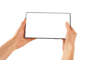  In female hands is a tablet with a blank screen. The tablet is horizontally in female hands on a white background.