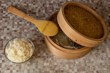 Rice cooked in a traditional wooden steamer has a special taste. You can eat it as a separate dish, as a side dish, or as an addition or ingredient to other dishes. In any case, it is very healthy.