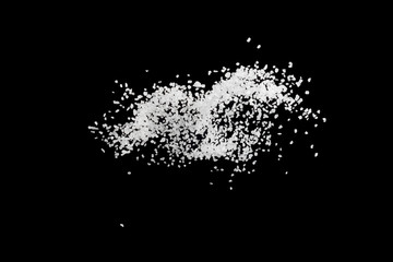 Obraz premium Sea salt explosion isolated on black background close up