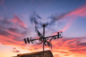 Weather vane spinning in strong wind