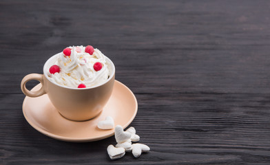 Cup of coffee with decoration -marshmellow, cream, berries