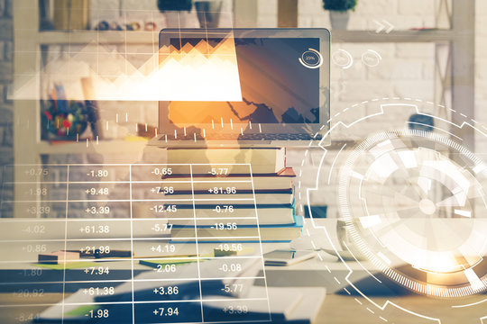 Financial graph colorful drawing and table with computer on background. Double exposure. Concept of international markets.