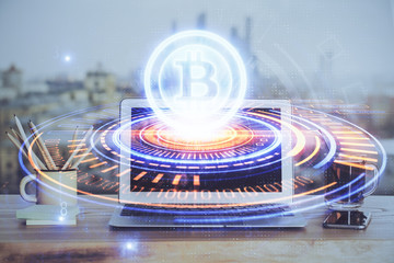 Double exposure of blockchain theme hologram and table with computer background. Concept of bitcoin crypto currency.