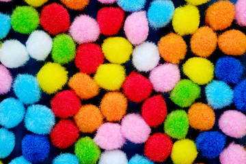 Colorful balls and colorful of background. Background of colored soft balls. Accessories for needlework and children's creativity