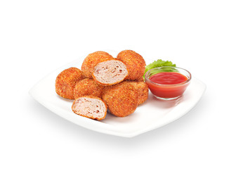 Delicious Crispy Chicken Nuggets in batter with ketchup and lettuce