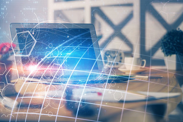 Multi exposure of table with computer and world map hologram. International data network concept.