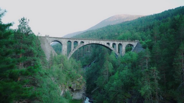 fast flowing river under a old stone bridge - Kylling bru in Norway