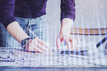 Multi exposure of man standing and planing investment with stock market forex chart.