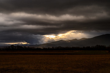 Naklejka na ściany i meble Low clouds covering the surrounding peaks in Retezat Mountains National Park - Hunedoara