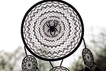 Obraz premium Handmade dream catcher with feathers threads and beads rope hanging