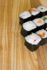 Fresh and delicious rolls, sushi and Japanese cuisine. rolls with salmon, avocado, cucumber, flying fish ROE and cream cheese inside. Sushi menu. Flatley food. the view from the top.