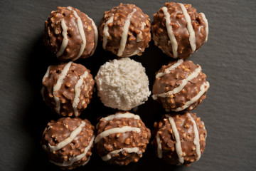Chocolate balls with nuts, close up.