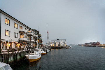 Fototapeta premium Harbor with fishing boats and Scandinavian fisherman's houses. Henningsvaer, Lofoten islands.