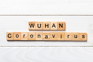 Wuhan coronavirus word written on wood block. text on wooden table for your desing, Wuhan Coronavirus, 2019-nCoV. concept top view