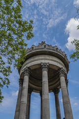 Parc des Buttes-Chaumont (1867) - Public Park in northeastern Paris. Most famous feature of park is Temple de la Sibylle (1867) - miniature version of ancient Roman Temple of Vesta. Paris, France.