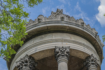Parc des Buttes-Chaumont (1867) - Public Park in northeastern Paris. Most famous feature of park is Temple de la Sibylle (1867) - miniature version of ancient Roman Temple of Vesta. Paris, France.