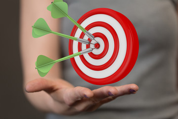 hand holding a target with darts hitting the center over white background. Concept of .