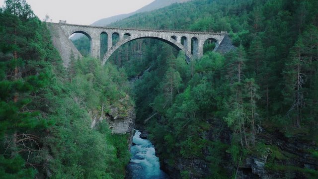 Old Stone Bridge Spanning over river -evening shot of kylling bru in norway