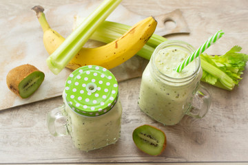 green fresh healthy smoothie with fruits and vegetables, detox concept