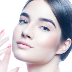 Close-up beauty face of young model woman with natural makeup, perfect skin. Skincare facial treatment concept