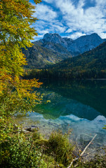 Fototapeta na wymiar Peaceful autumn Alps mountain lake with clear transparent water and reflections. Langbathseen lake, Upper Austria.