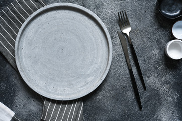 Table setting. Empty plate, knife, fork and napkin. Top view and flat lay with copy space