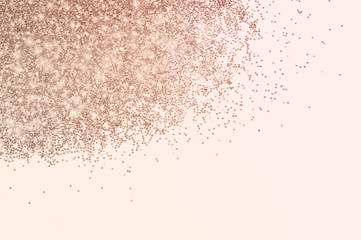 Pink glitter on light pink background. Beauty, cosmetics, holidays, party concept